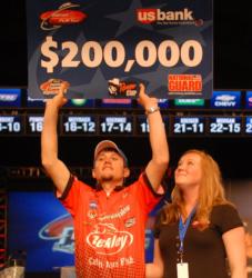 Berkley pro Stetson Blaylock receives his winner's check with Lindsey, his fiance.