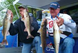 Pro Jim Preissner and co-angler Rick Norris hold up their day-one catch. With 25 pounds, 12 ounces, each angler is in fifth place.