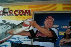 Co-angler Debra Cunningham of Phoenix weighed the biggest bass of day three, this 8-pound, 14-ounce largemouth.