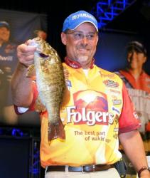 Third-place pro Scott Suggs holds up a nice smallmouth he caught on day two of the Forrest Wood Cup.