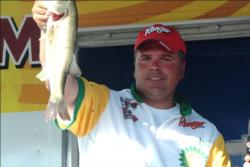 Crowd favorite Chad Kerrof Burlington, Iowa, proudly displays part of his second-place catch during the Stren Series event at Fort Madison.