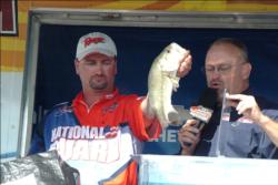 Co-angler Brien Vaughn weighs in his catch en route to victory on the Mississippi River.