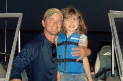Toby Kvalevog and his daughter enjoy an evening on the water. 