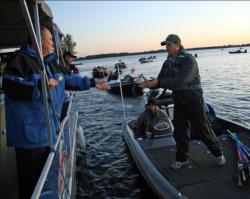 Anglers make their way through boat check on day one.