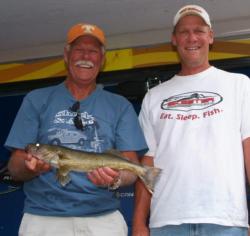 Jim Klein and Zach Afseth hold up a Lake Wissota walleye that measured just under 20 inches.