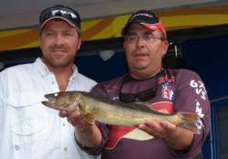 Terence Filkins and Brian Wolter show off their biggest walleye from day one of the FLW Walleye League Finals.