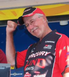 After weighing in another five-fish limit, third-place boater Bernie Neuhaus celebrates.