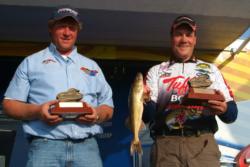 Kirt Hedquist and Troy Zupke hold up their trophies for winning the 2009 FLW Walleye League Finals on Lake Wissota.