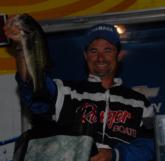 Joel Richardson shows off his winning fish.