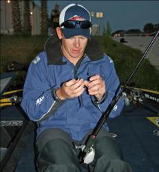 Tom Frink of Kennesaw State ties on a Carolina Rig, one of the baits he