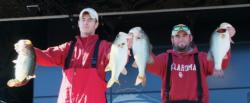 Oklahoma teammates Chip Porche and Mark Johnson hold up part of their 34-pound, 8-ounce stringer. 