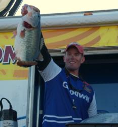 Pro Keith Combs holds up a giant Falcon Lake bass he caught on day three. Combs finished the event in second place.