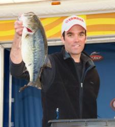 Third-place co-angler Mark Myers holds up his biggest bass from day three on Table Rock Lake.