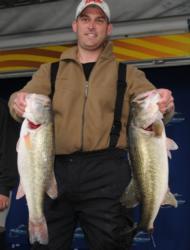 Matt Hults of Gautier, Miss., shows off his catch during the FLW Series Eastern Division on Lake Eufaula.