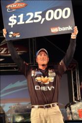 Bryan Thrift of Shelby, N.C. displays his first-place check after capturing the tournament title on Lake Norman.
