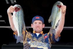 Murray State University team member Steve Miller shows off his catch. Murray State University finished the first day of national championship competition in second place.
