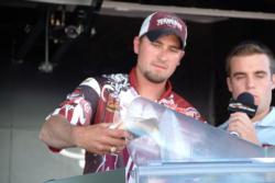 Texas A&M team member Paul Manley weighs in his catch. Texas A&M finished the day in third place.