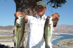 Co-angler Roland Andrade of Carona, Calif., shows off part of his wininng catch at the FLW Series event at Lake Mead.