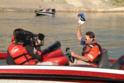 National Guard pro Tim Klinger tips his hat the crowd shortly after day-four takeoff commences on Lake Mead.