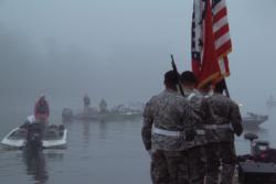 Amidst a backdrop of dense fog, the Arkansas National Guard helps kick off the start of pre-tournament ceremonies on Lake Ouachita.