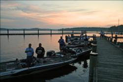 Anglers pause at daybreak for the playing of the national anthem.