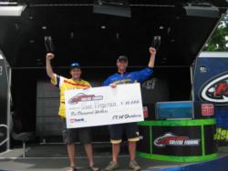 The West Virginia University team of Corey Straight and Corey Hill proudly display their first-place check after winning the FLW College Fishing tourament on the Potomac River.