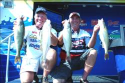 Pro Eric Olson of Red Wing, Minn., and co-angler David Hosek of White Bear Lake, Minn., caught a limit of walleyes weighing 15 pounds, 8 ounces to win the FLW Walleye Tour Western Division tournament on Oahe Lake.