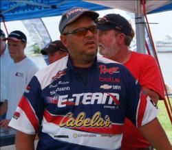 Paul Meleen patiently waits to weigh in his three walleyes Friday.