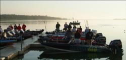 The top 10 pros and top 10 co-anglers pause for the playing of the National Anthem Saturday morning.