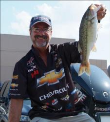 Chevy pro Larry Nixon holds up one of the five bass he caught on day three of the Forrest Wood Cup.