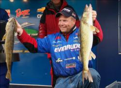 Third-place pro Chris Gilman holds up his two overs from Thursday