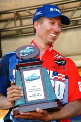 Brent Ehrler of Redlands, Calif., proudly displays his 2010 FLW Series Western Division Angler of the Year trophy before the start of final weigh-in.