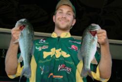 Humboldt State University team member Derrick Hicks proudly displays his team's 7-pound, 4-ounce catch. Humboldt State ultimately qualified for the FLW College Fishing Western Regionals after finishing the Lake Roosevelt event in third place.