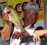 Tripp Pittman of Holly Springs, Miss., puts his winning fish into the scales.