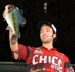 Chico State team member Frank Vogt shows off part of his catch at the FLW College Fishing Regional Championship on Folsom Lake. Chico State finished the day in second place after recording a total catch of 12 pounds, 8 ounces.