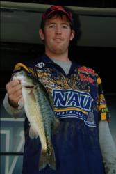 Northern Arizona University teammate Brent Perkins shows off his catch en route to a fourth-place finish after the first day of competition on Folsom Lake.