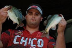 Chico State teammate Thomas White proudly displays his catch en route to a second-place finish during the second day of FLW College Fishing regional competition on Folsom Lake.