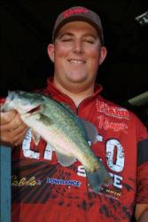 Marshal Smith of Chico State shows off part of his team's second-place catch at the FLW College Fishing Western Regional Championship.