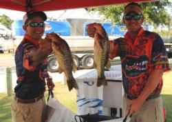 Dennis Croyle and Travis Gates of the University of Florida show off some of the fish that got them to second place.
