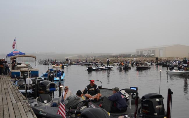 Anglers patiently wait for the fog to lift Thursday morning.