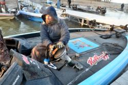 Kellogg Rice Krispies Treats pro Jim Tutt warms his hands before takeoff on a chilly Sam Rayburn Reservoir.