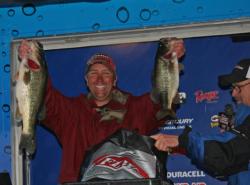 Pro winner Ken Howden shows off two of the big bass he caught on day three.