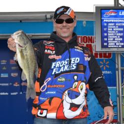 Second-place pro Dave Lefebre shows off his biggest bass from day two on Beaver Lake.