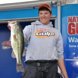 Fourth-place co-angler Philip Jarabeck holds up a 5-pound, 7-ounce Beaver Lake largemouth, the Snickers Big Bass of day two.
