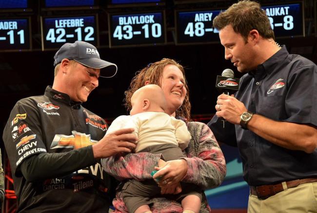 Pro winner Bryan Thrift celebrates his second FLW Tour win with his wife Allison and son Wiley.