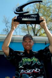 Pro Todd Castledine of Nacogdoches, Texas, proudly displays his first-place trophy after winning the EverStart Series event on the Toledo Bend Resevoir.