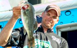 Pro Todd Castledine of Nacogdoches, Texas, weighs in his first-place catch during the final day of competition on Toledo Bend. 