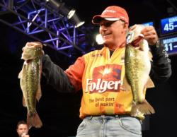 Second-place pro Tom Monsoor holds up his two biggest bass from day three on Lake Hartwell.
