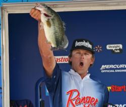 Second place co-angler Lester Albury celebrates a big fish at the weigh-in.
