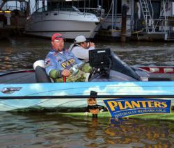 Planters pro Jim Dillard idles toward boat check on the Red River.
